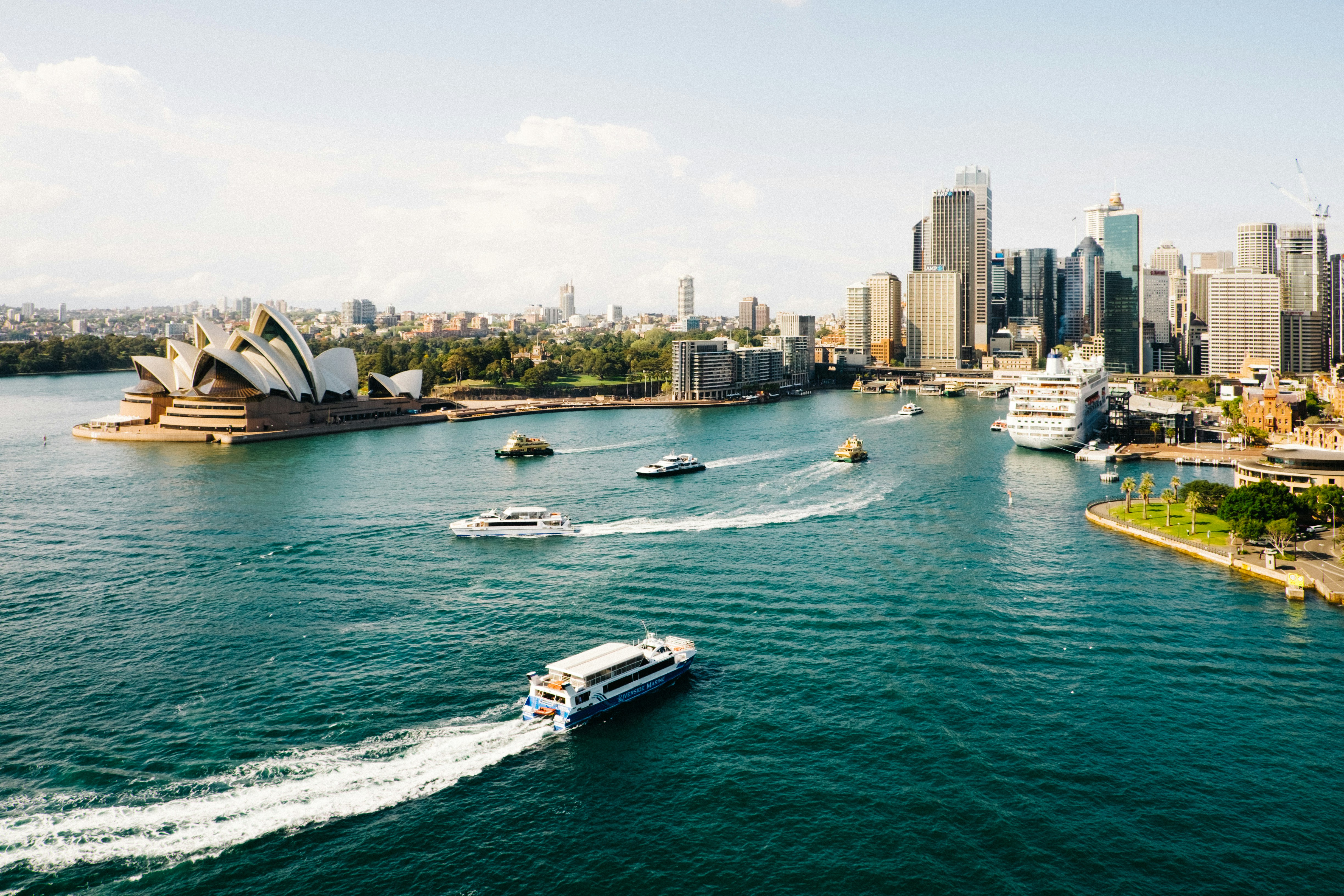 Drone view of the Sydney port backed by the city skyline in Australia