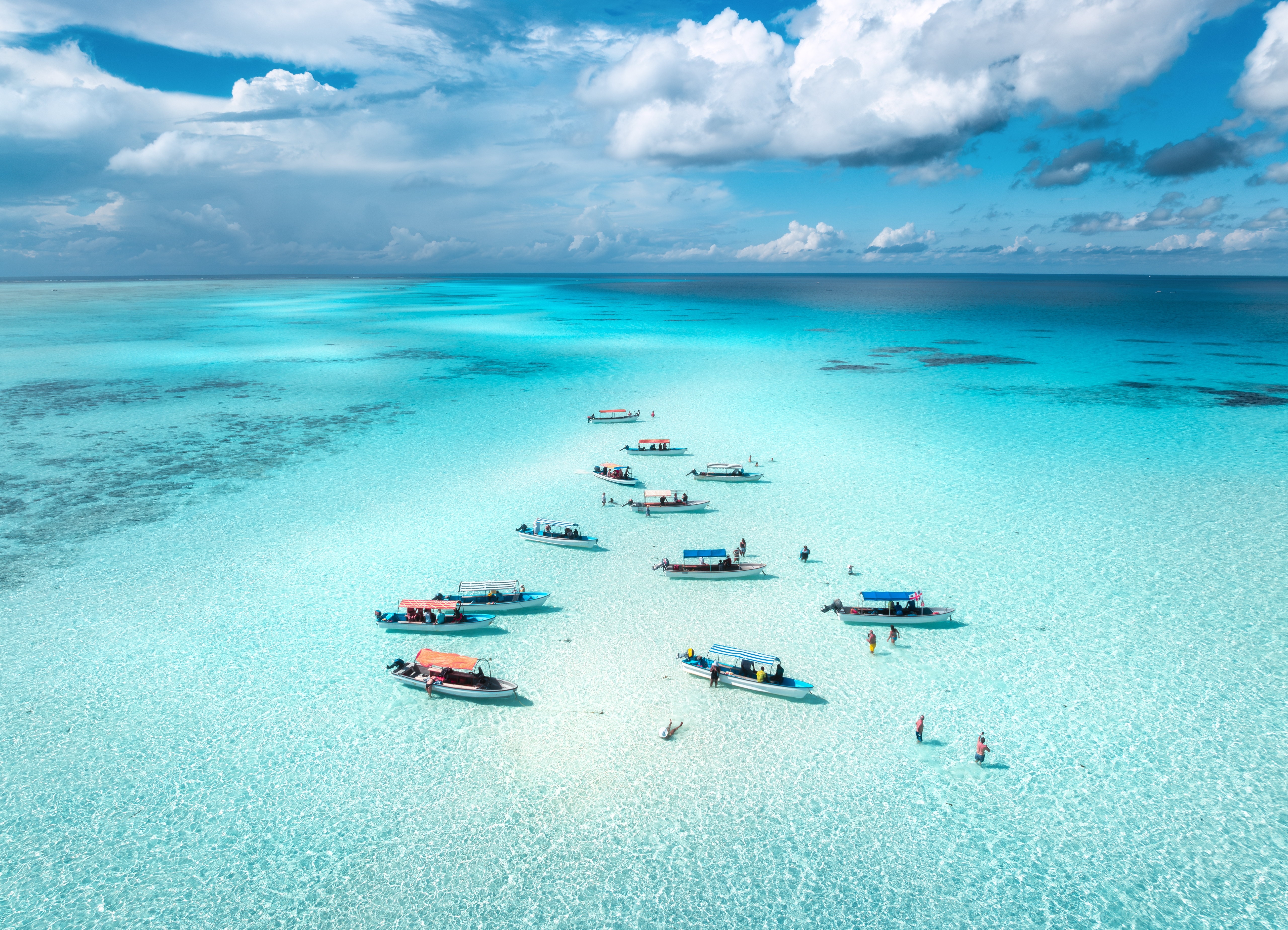 boats in turquoise Indian Ocean in Zanzibar