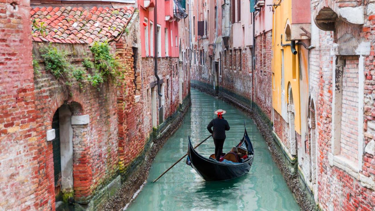 Riding gondola in Venice