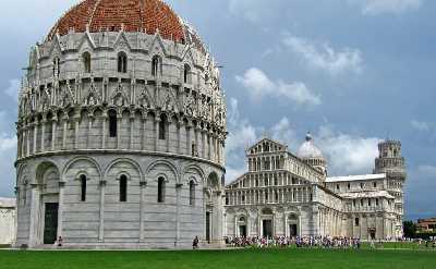 Admire the Baptistry in the heart of Pisa, Piazza dei Miracoli.