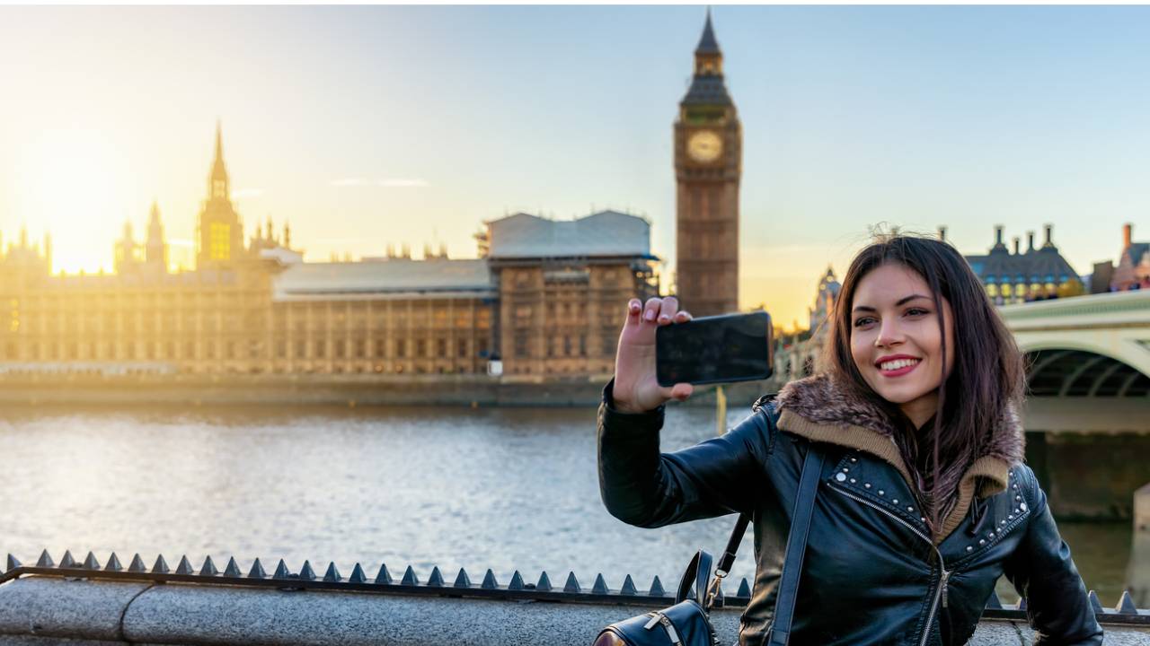 London girl taking selfie Thames