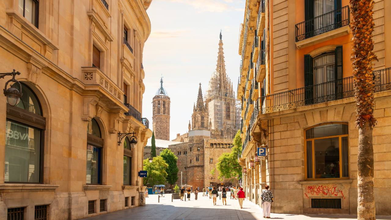 Pretty street in El Born, Barcelona, with the Sagrada Familia in the background